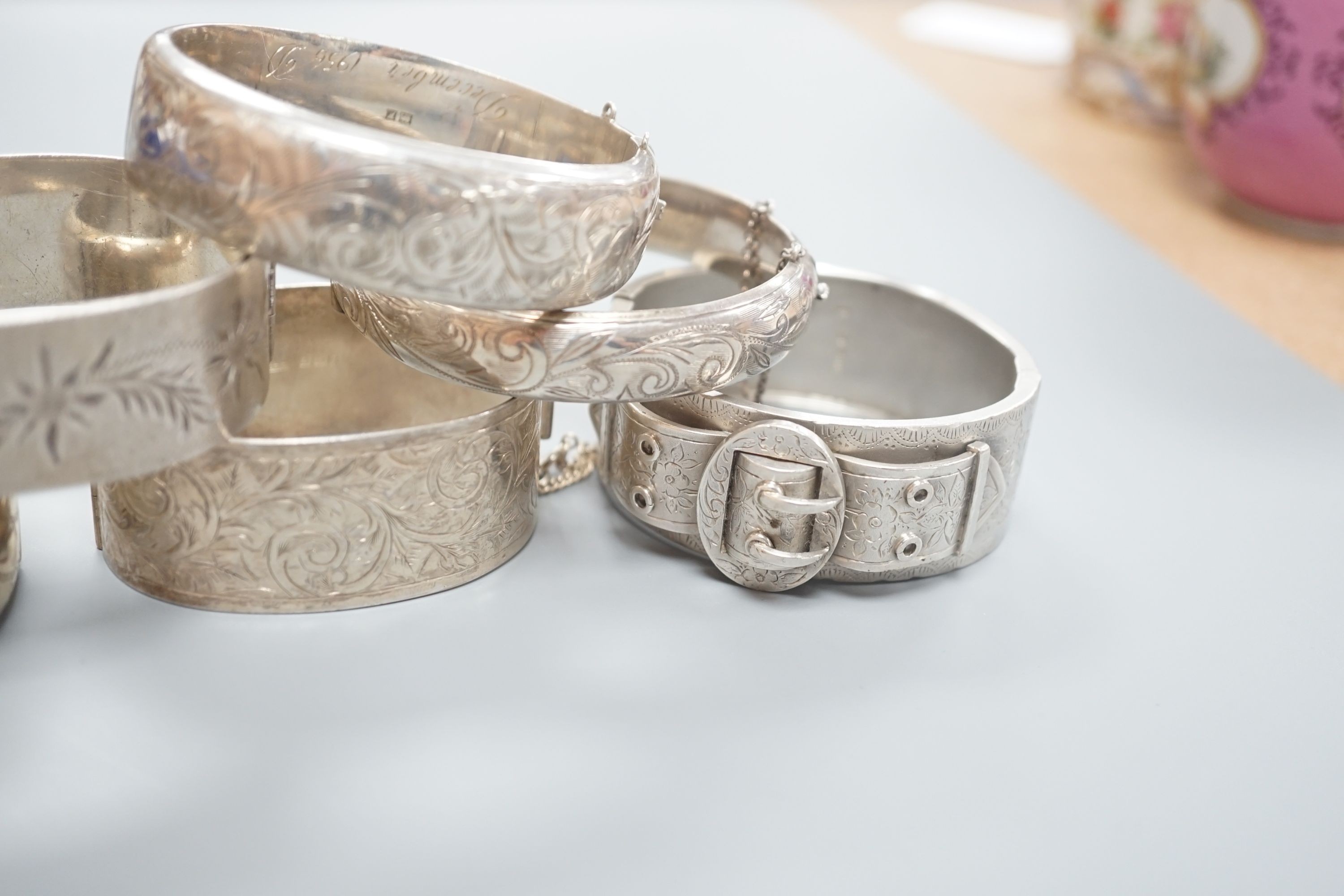 A Victorian silver bangle, Birmingham, 1885 and five later silver bangles.